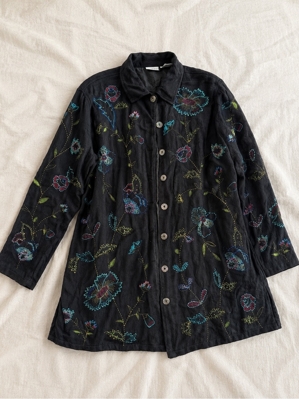 Black whimsical floral embroidered top